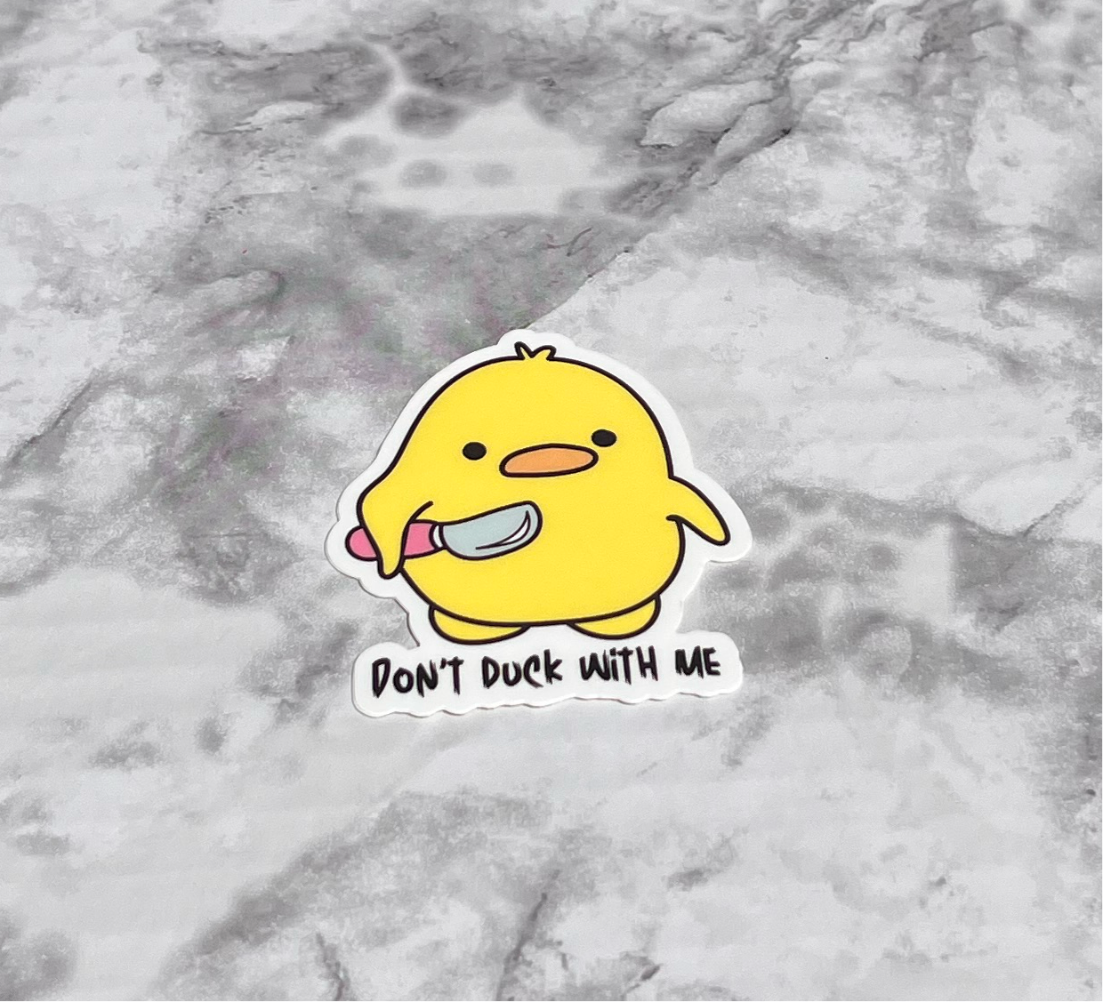 Don’t Duck With Me Sticker with yellow duck yielding pointy object with text that reads “Don’t duck with me”